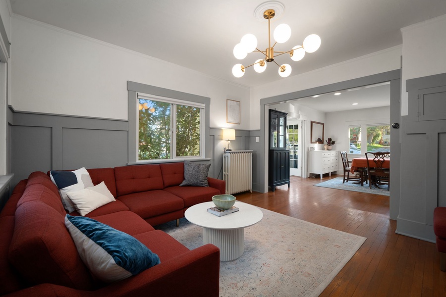 Settle into the bright living room filled with natural light and cozy seating.