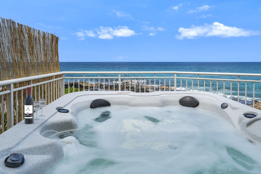 Relax in the hot tub with a front-row view of the ocean in our premium Hawaiian vacation home, perfect for serene getaways.