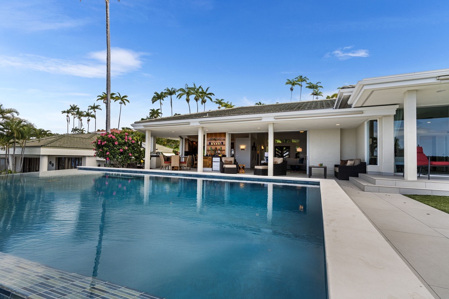 Dive into paradise—this stunning infinity pool is just steps from your lanai.