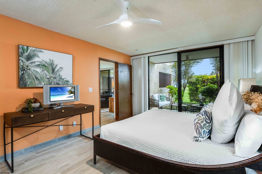 Unwind in the primary bedroom with serene views and direct lanai access—ideal for a peaceful retreat anytime of day.