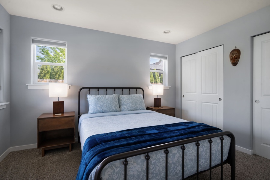 Enjoy restful nights in this bright queen sized guest bedroom with blackout drapes and central A/C for added comfort.
