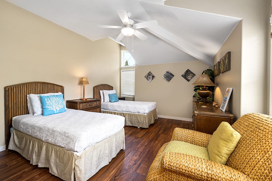 Guest room furnished with twin beds that can be combined for flexible sleeping arrangements.