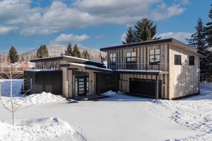 Modern Mountain Luxury nestled in a winter landscape.
