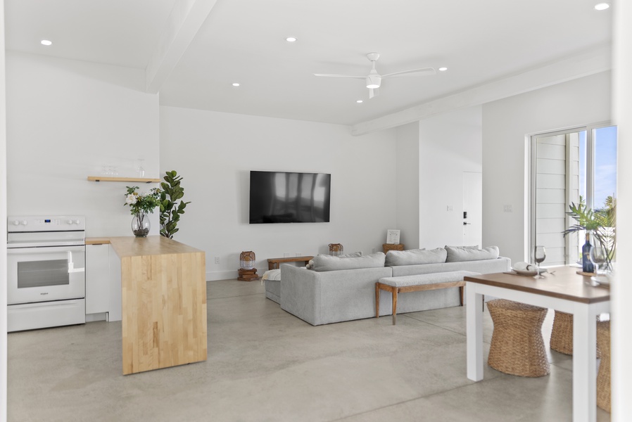 A large smart TV in the living area sets the scene for cozy movie nights.