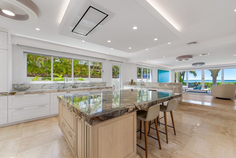 Spacious culinary hub featuring two islands and dual sinks—tailored for group cooking and casual dining.