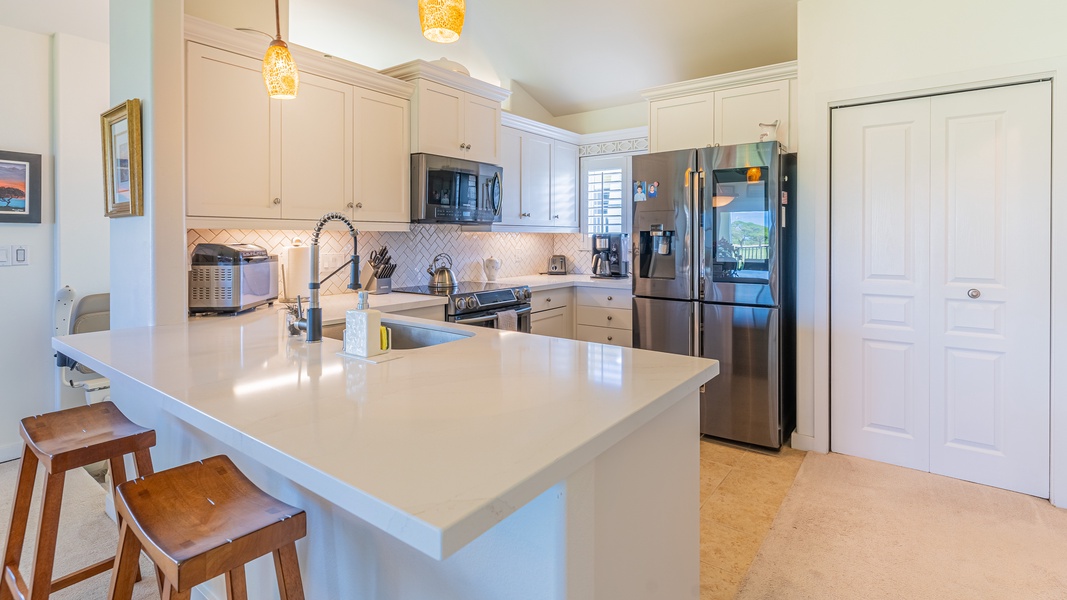 The open floor plan in the kitchen and beautiful lighting is the heart of the home.