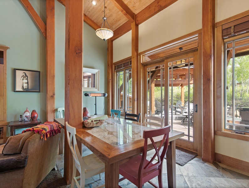 A gateway to outdoor bliss: The dining area offers easy access to the patio and gazebo, inviting you to dine amidst nature's embrace