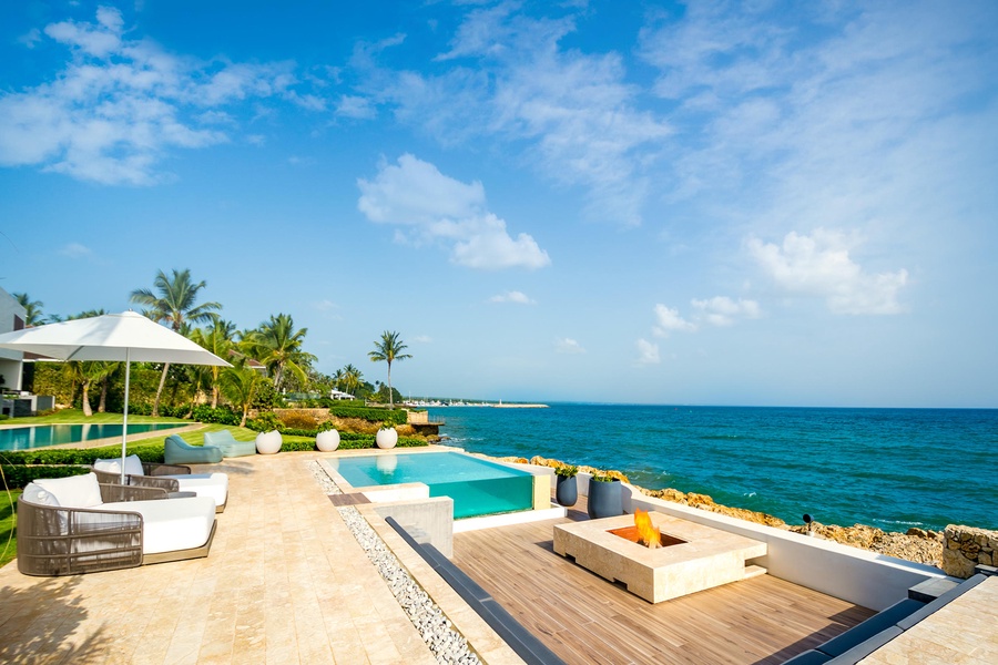 Relax by the infinity pool, taking in the stunning ocean vistas of Casa de Campo.