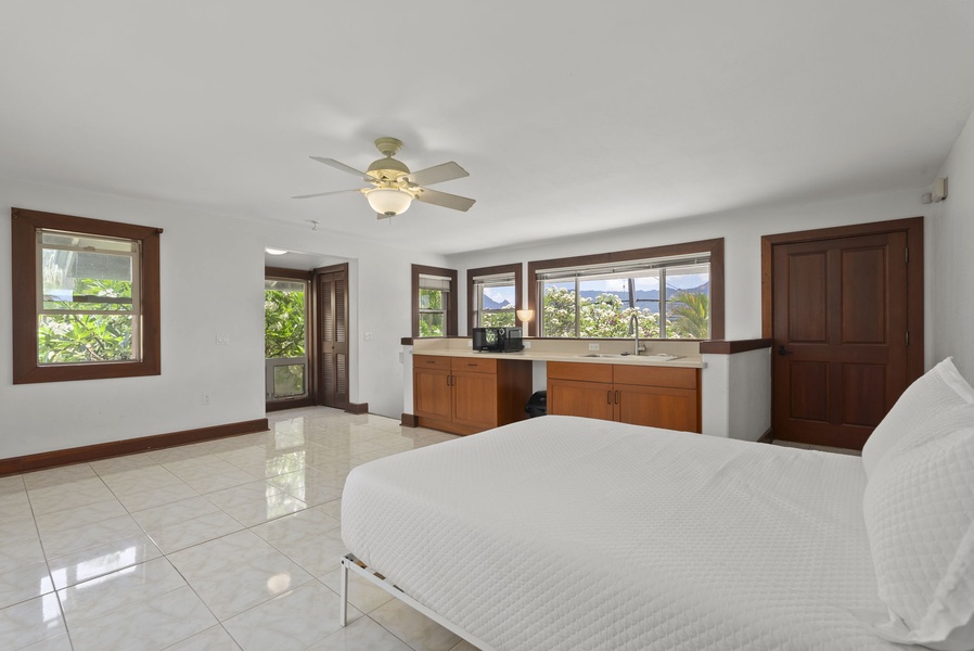 Fifth guest suite with convenient kitchenette for extended stays.