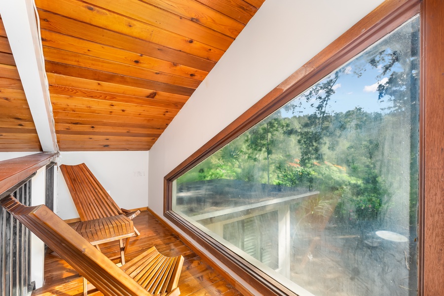 Picture window at the observation ledge in the loft overlooks the forest reserve