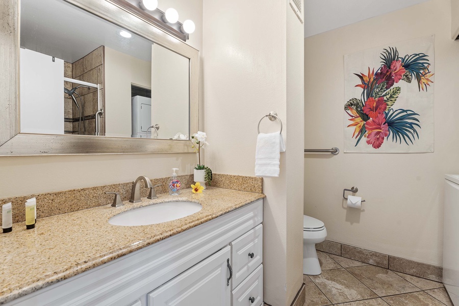 Clean and modern ensuite bathroom featuring a stylish single sink — a private oasis for freshening up.