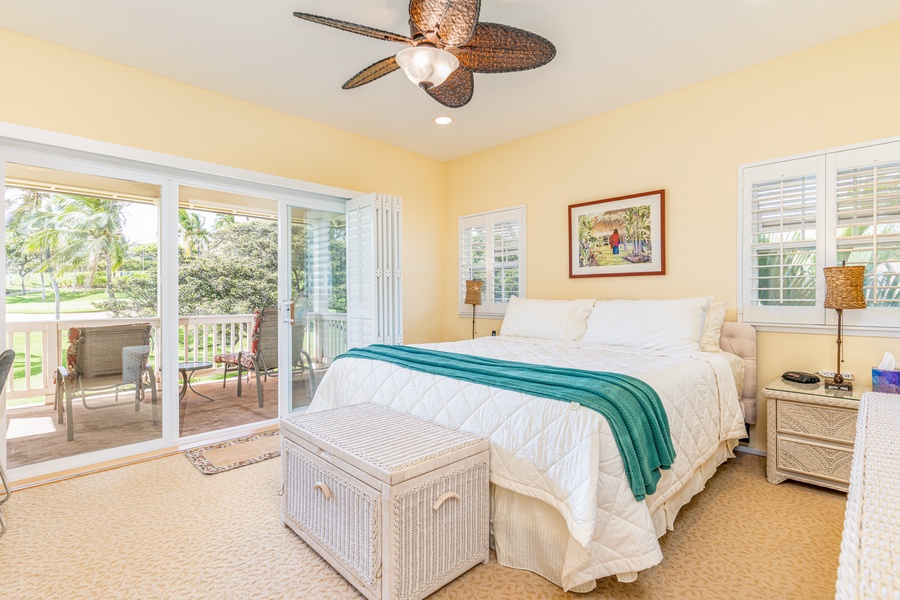 Enjoy the breeze and natural light in this peaceful upstairs retreat with ceiling fan and private lanai access.