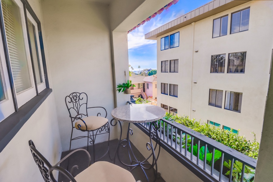Enjoy your morning coffee on guest room 1's private patio with garden views.*