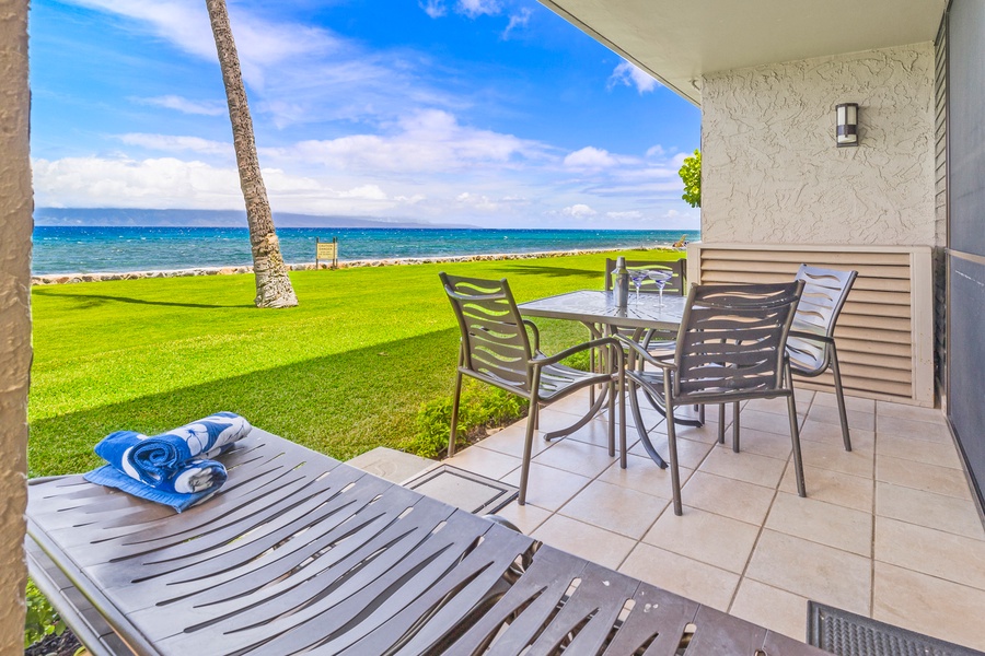 Relax on the lanai with uninterrupted oceanfront views, perfect for a serene morning coffee or an alfresco meal in paradise.