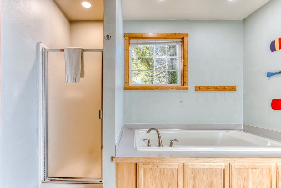 Primary ensuite has walk-in shower and a relaxing soaking tub.