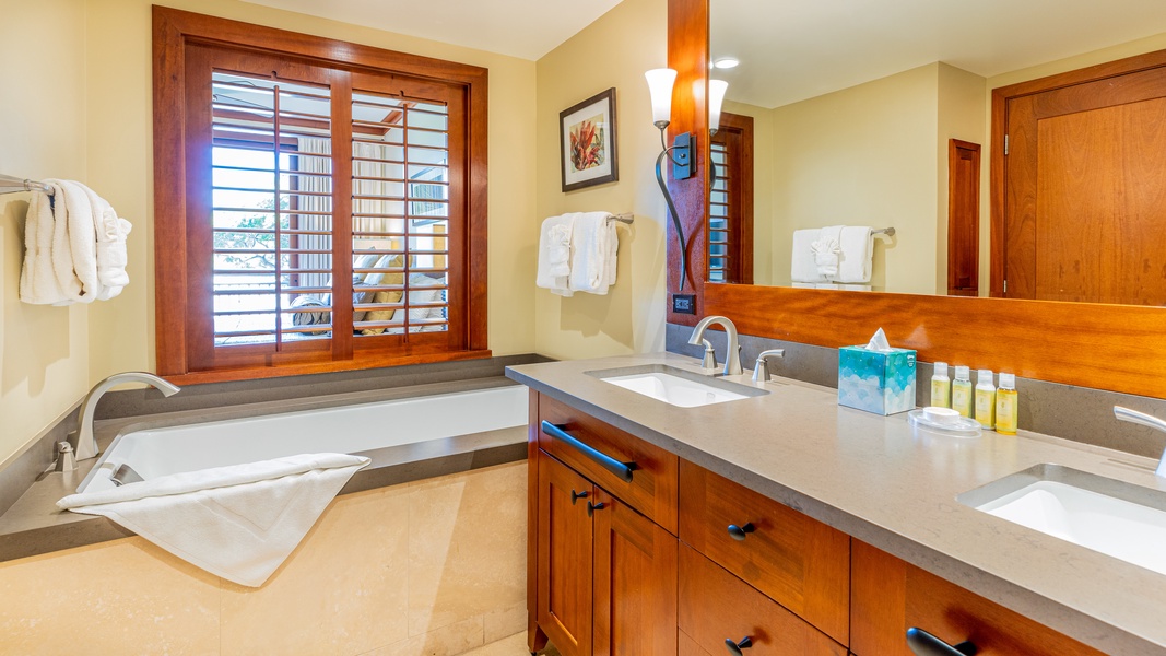 The primary guest bathroom with a soaking tub to relax and renew.