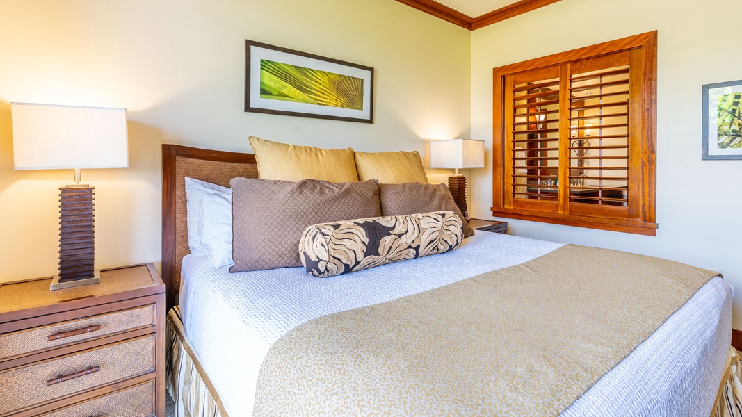The beautifully appointed primary guest bedroom with luxurious comfort for a restful stay.