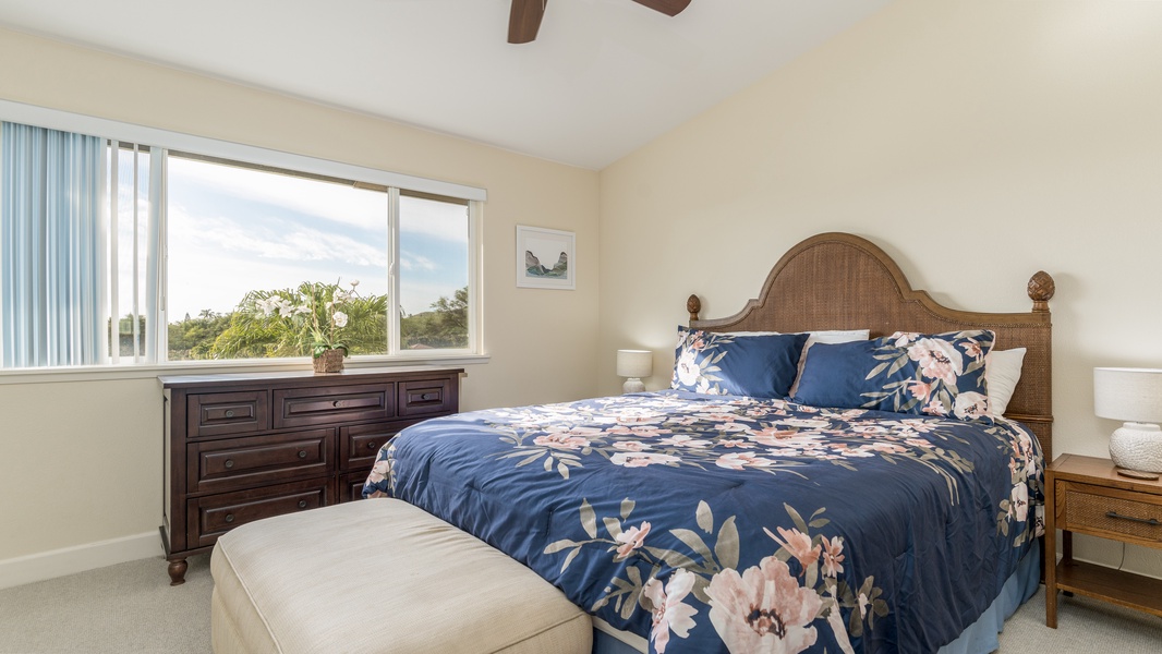 The Primary Bedroom has a large window looking out over the rear yard, as well as its own flat-screen TV.