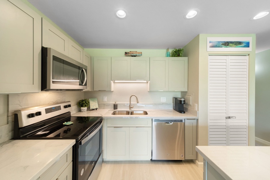 Bright and modern, fully equipped kitchen with stainless steel appliances