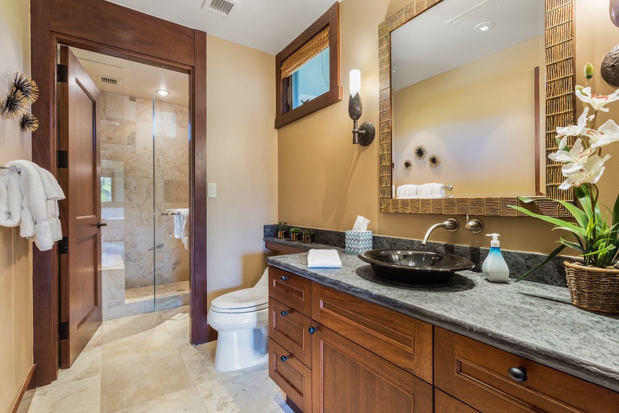 Third full bath, detached, with chic fixtures and walk-in shower.