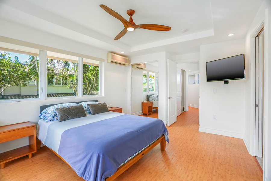 Drift into peaceful dreams in your airy bedroom, where tropical garden views and gentle ceiling fan breezes create the perfect retreat.