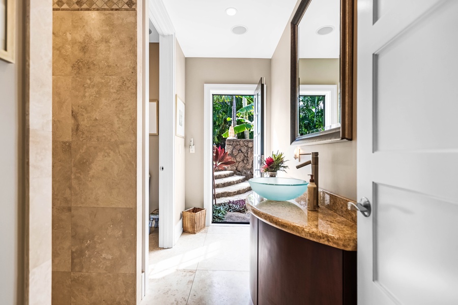 Spa-inspired bath with access to garden and private lanai.