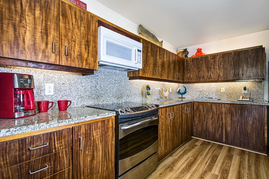 Spacious kitchen with granite counters and upgraded appliances!