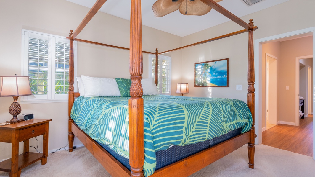 The spacious primary guest bedroom with a king size bed.