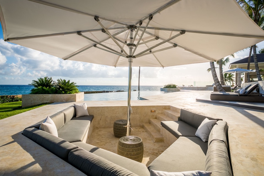 Lounge in the shaded comfort of a plush outdoor seating area.