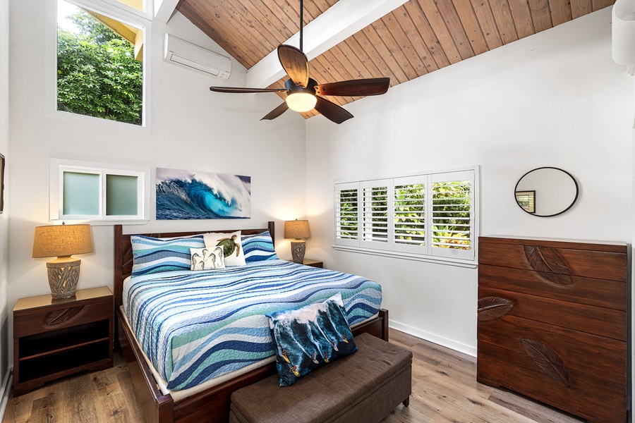 Drift off in a serene bedroom, where soft light and vaulted ceilings create calm.