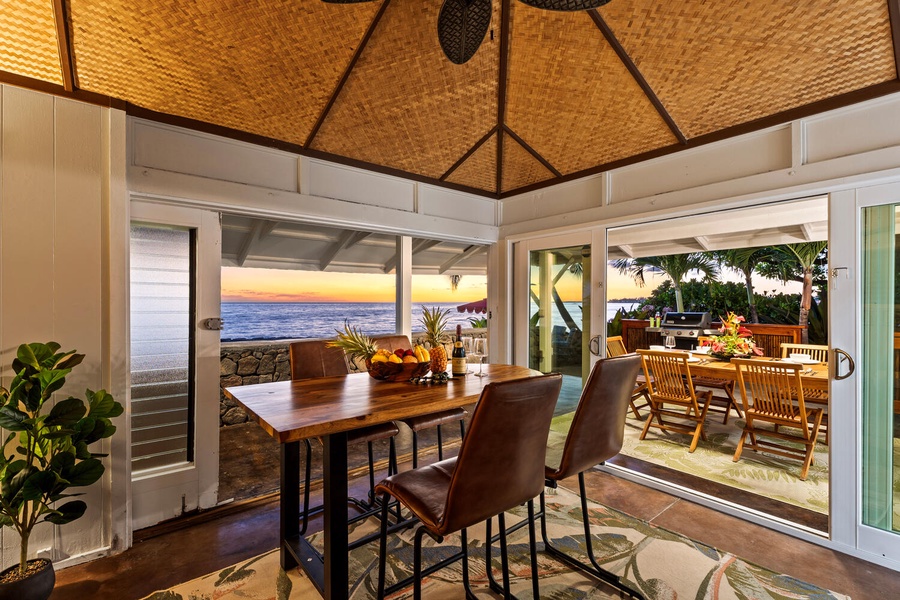 Spacious indoor dining area where guests can gather for meals with panoramic coastal views.