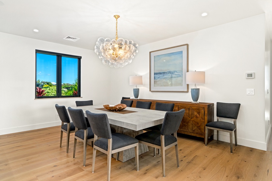 Gather around this elegant dining table for memorable meals with stunning garden views through expansive windows.