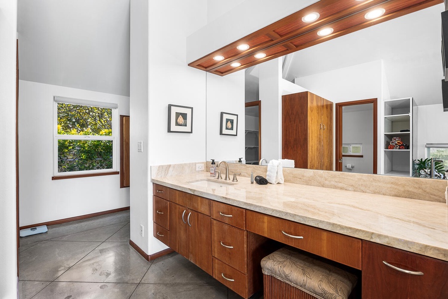 Double vanity with ample counter space and natural light—perfect for couples or longer stays.