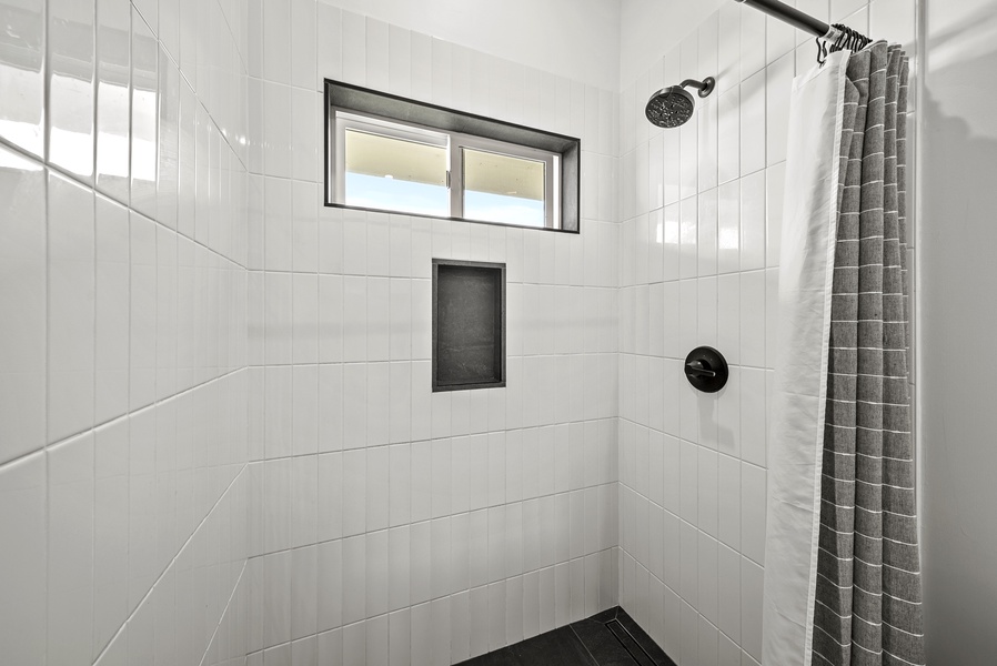 The separate walk-in shower offers a refreshing start or end to your day.