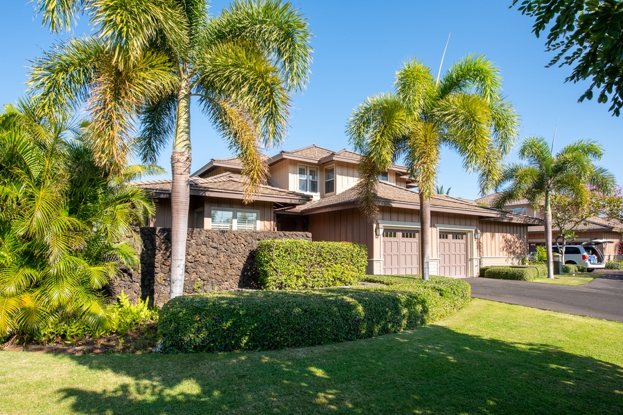 Beautifully Landscaped w/ Outdoor Shower Behind Rock Wall