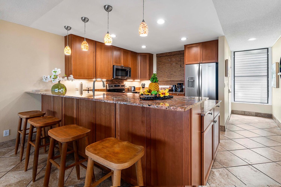 Enjoy casual conversations over morning coffee at the kitchen island, which comfortably seats three.