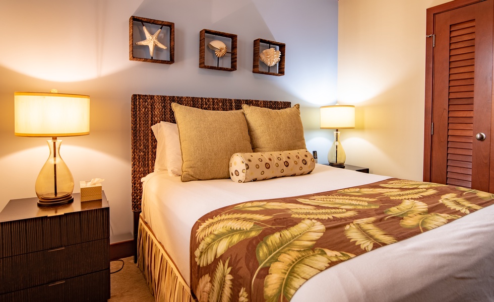 The second guest bedroom with delicate seashell decor and soft linens.