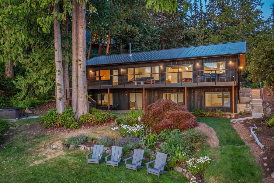 Relax in this modern home with spacious open-plan living, large windows, and a beautiful backyard perfect for enjoying nature.