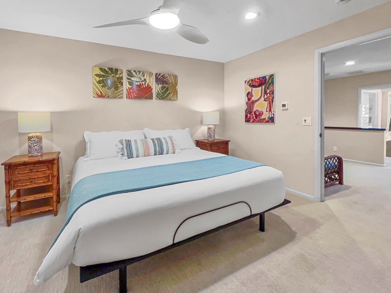 Guest bedroom 2 features a king bed, private ensuite with shower and adjacent den, for ultimate relaxation.