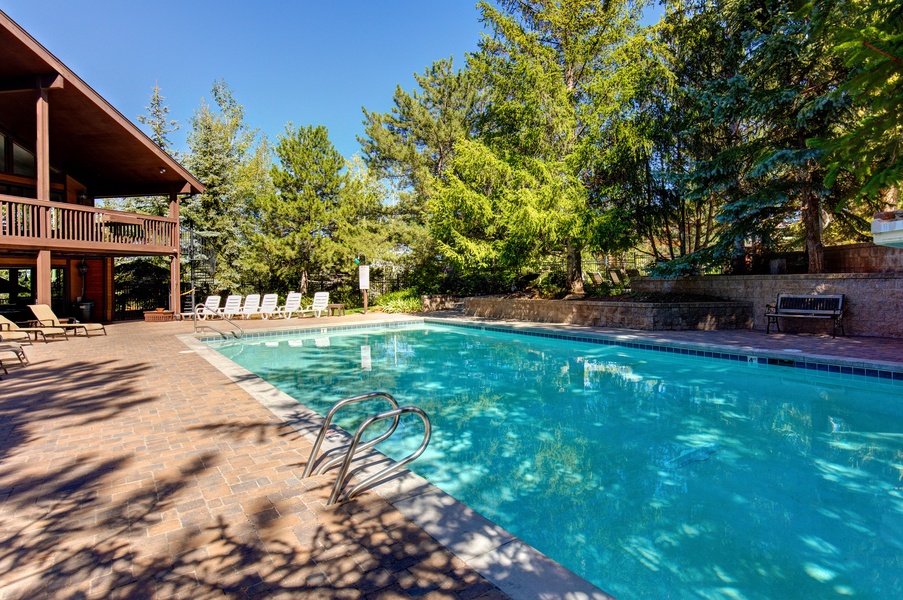 Condo amenities featuring the heated outdoor pools with lounge spaces
