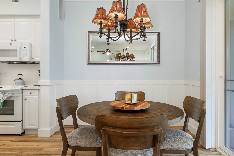 The formal dining space features warm wood tones and plantation-style charm for shared meals.
