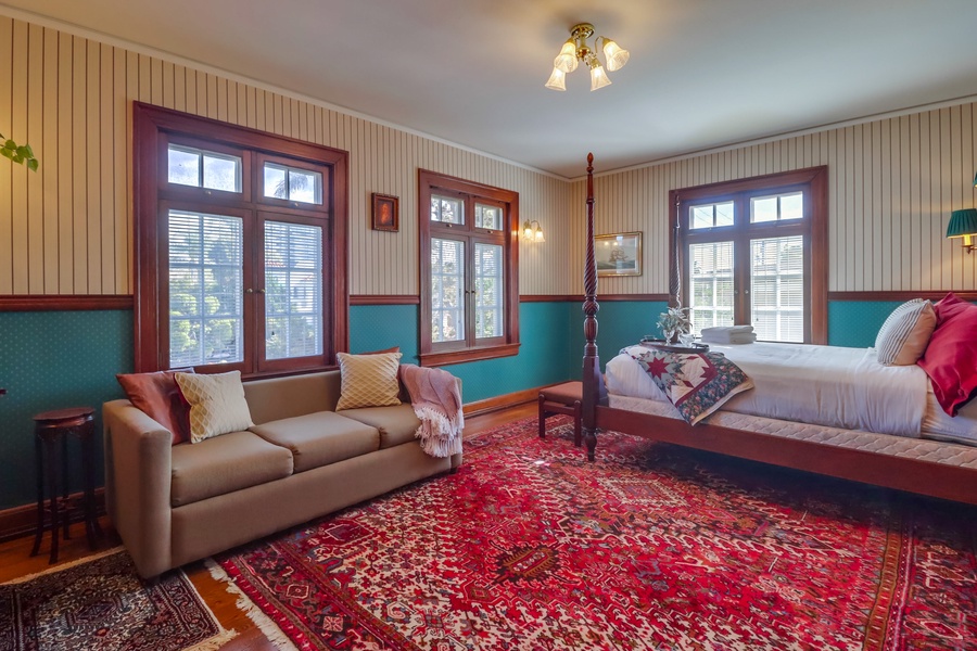 Guest bedroom 4 boasts a stunning four-poster king-sized bed and full size sleeper sofa.