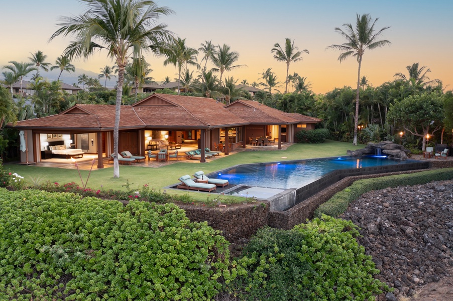 Twilight ambiance at the poolside lanai with glowing sunset skies.