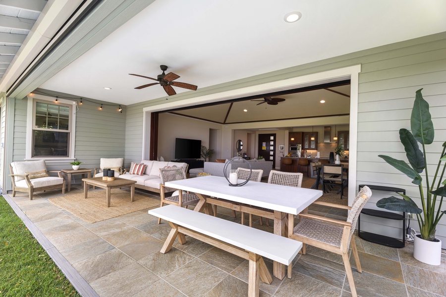 Dinner moves outside to the covered lanai, table and bench seating everyone who showed up hungry.