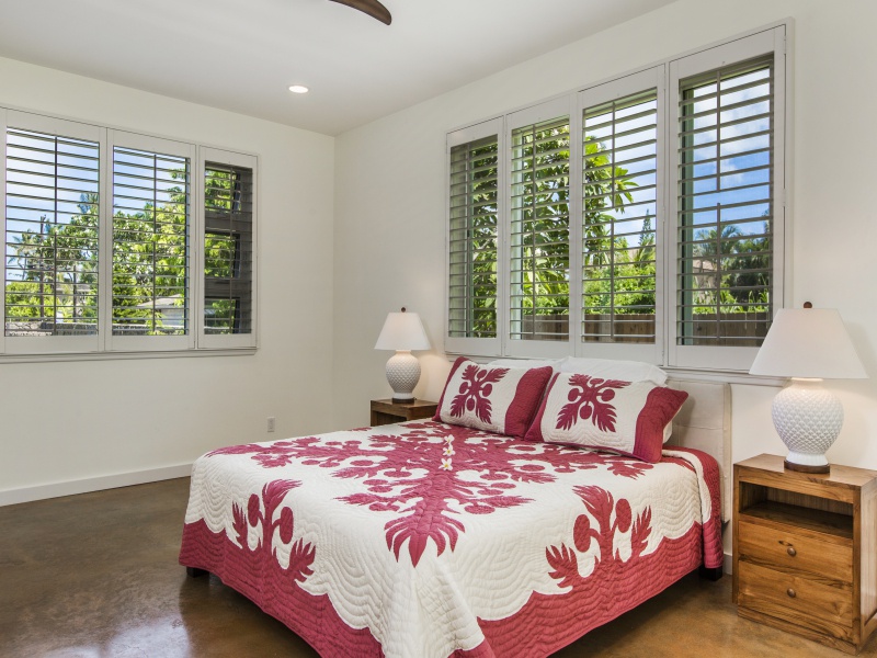 Adjustable plantation shutters allow light in according to your liking.