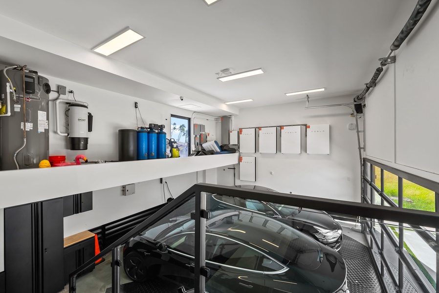 A sleek two-car garage ensures secure parking and easy loading after a day exploring Honolulu’s coastline.