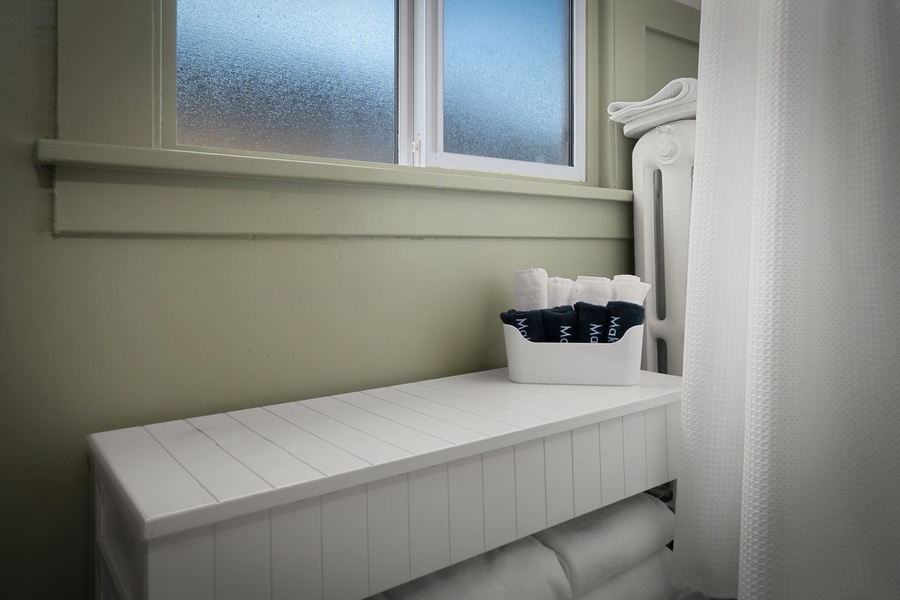 Grab fresh towels from this tidy built-in nook designed for comfort and convenience.