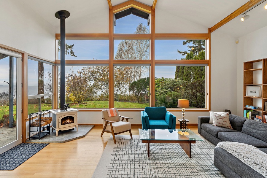 Cozy up by the wood-burning fireplace and soak in stunning lake views through soaring picture windows.