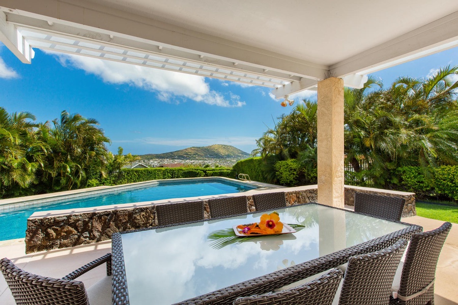 Outdoor seating by the pool overlooking Portlock and Koko Crater.