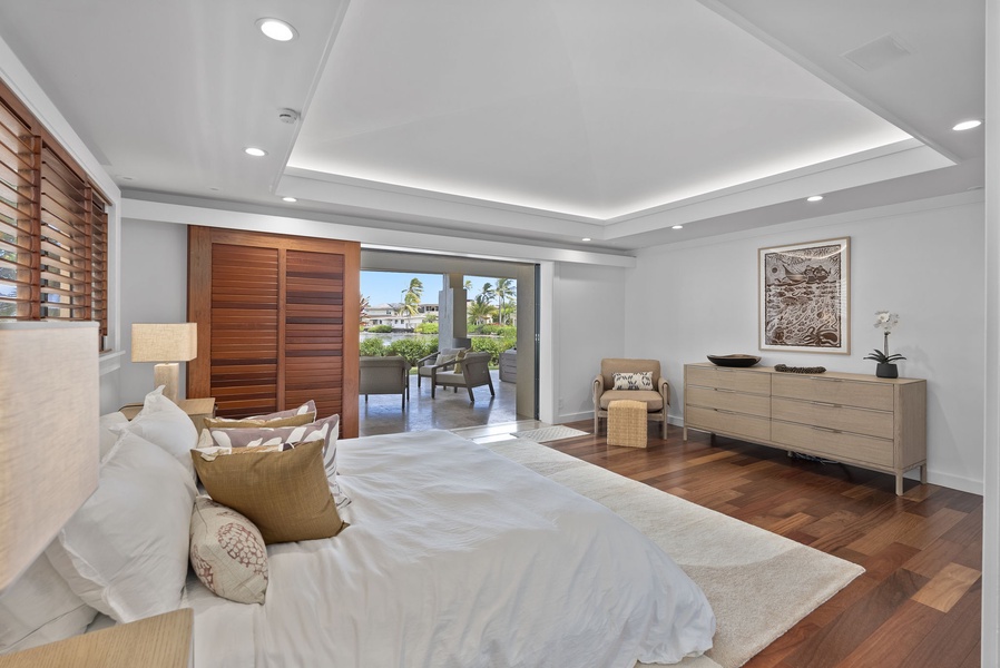 Light-filled bedroom with warm finishes and direct access to outdoor space.